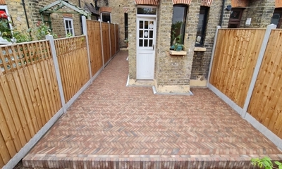 Versatile Mixt Bexhill clay pavers create a charming, durable house patio.