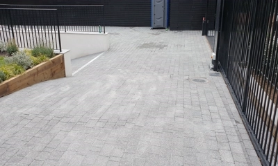 Elegant front driveway adorned with the sophistication of Argent Block Paving Dark.