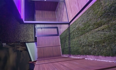 Warm tech composite battens create sleek, contemporary garden fence design.