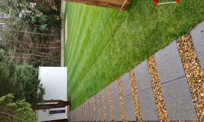 Expansive new lawn transforms the landscape with lush greenery.