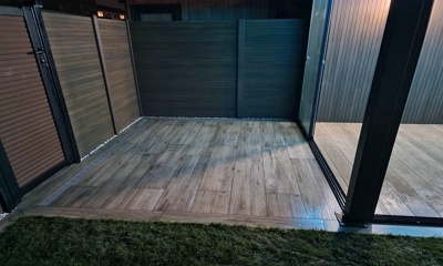 Combining the charm and warmth of natural wood with the resilience of hardy porcelain for this patio at Tilbury project 