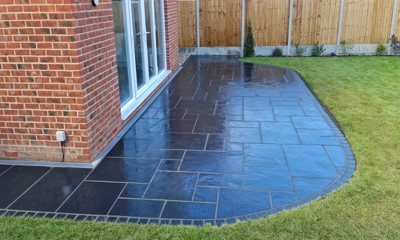 Brazilian black slate patio: timeless elegance, durability, available in various sizes.