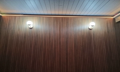 Pergolux interior wall adorned with warm tech composite battens, modern design allure.