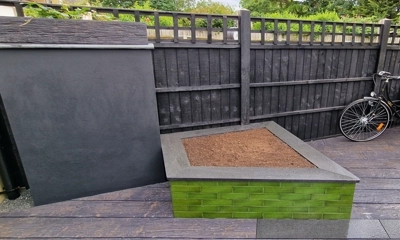  granite plank frames complement contemporary glazed brick facade for this planter 